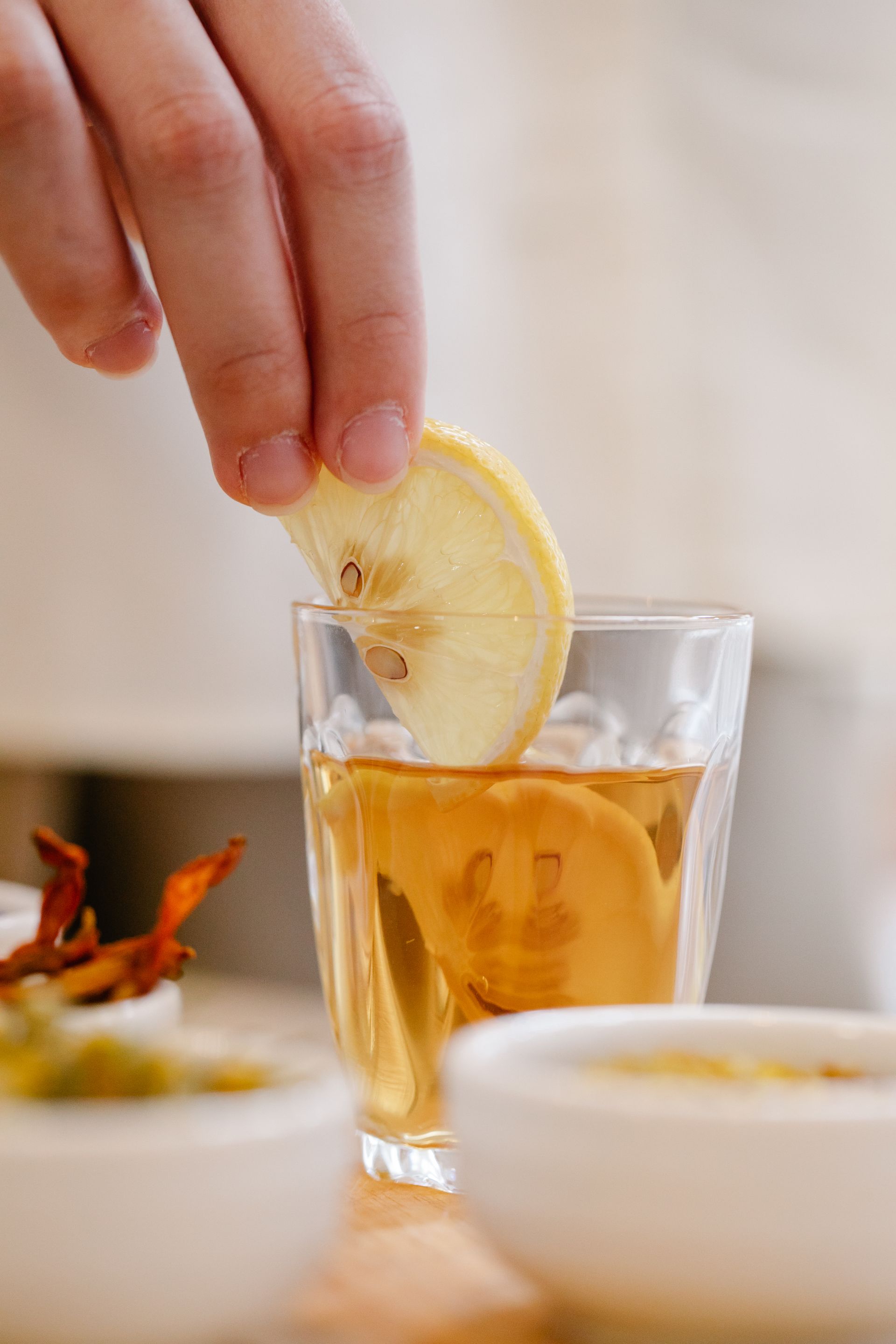 Lemons in a jar on a fridge shelf