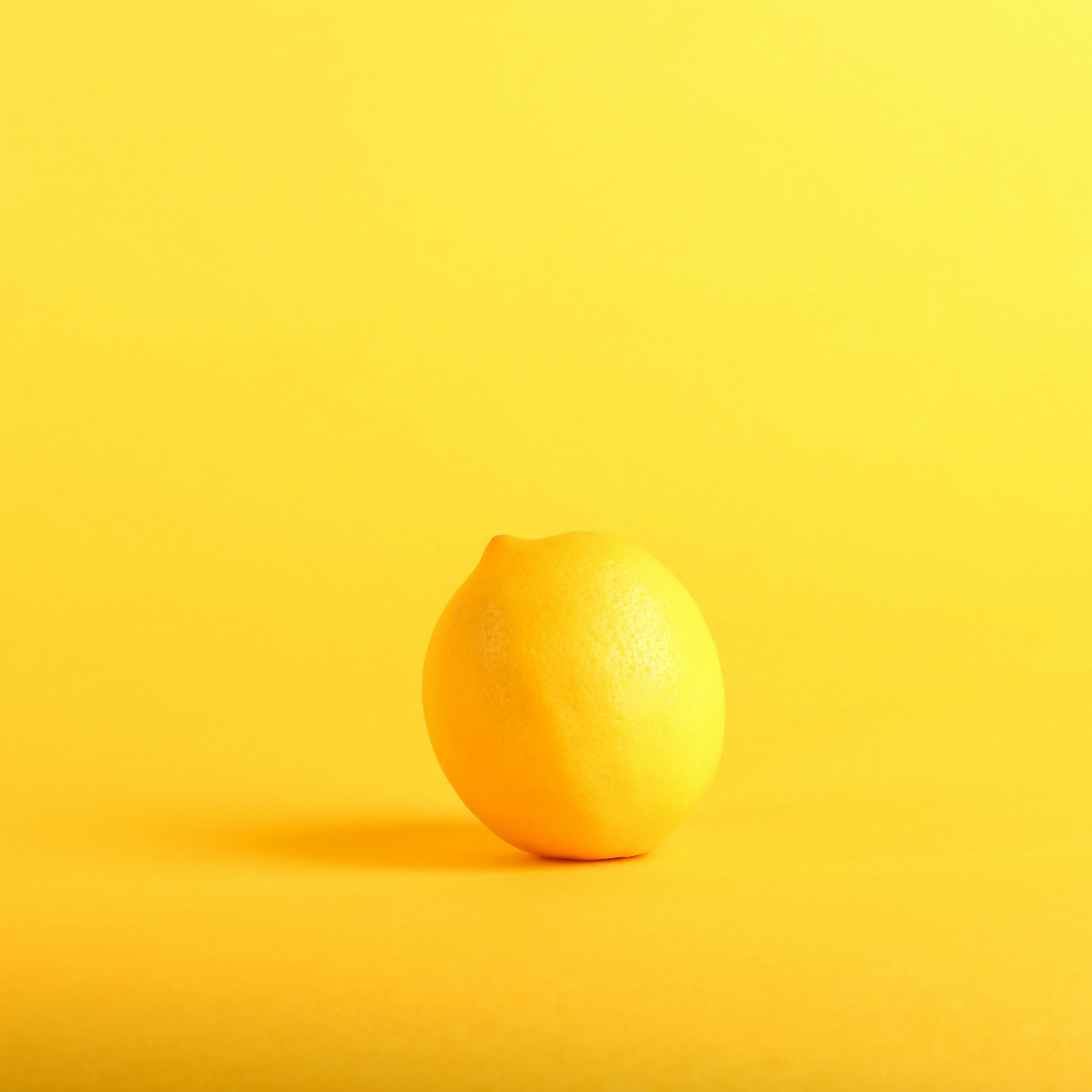 Zesting a lemon over a board